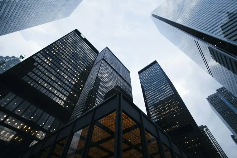 Glass and steel commercial building viewed from below
