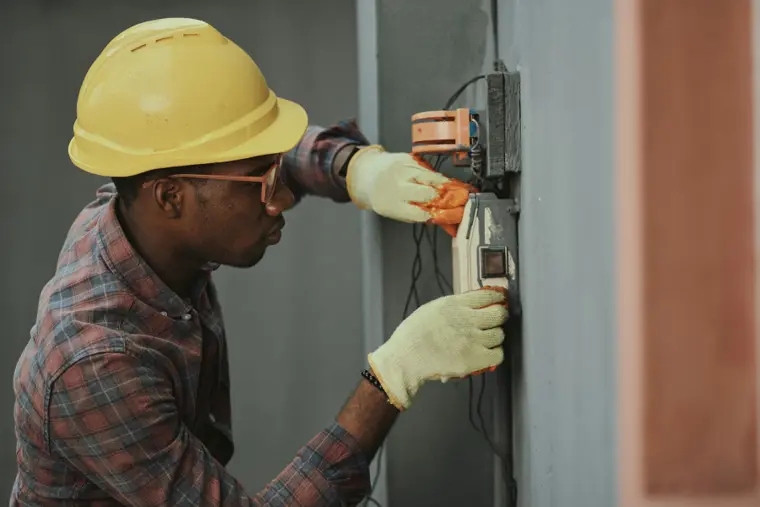 Illustrative tradesperson working on a building installation